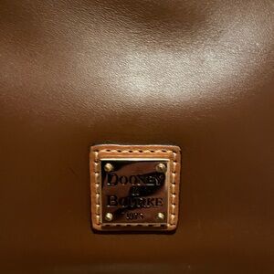 Like new, Dooney and Bourke handbag, complete with shoulder strap.